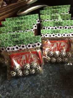 four bags of soccer balls sitting on top of a counter