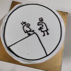 a cake decorated with two cartoon figures on it