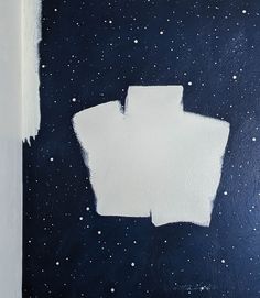 a painting with white paint on it and some stars in the sky behind it,