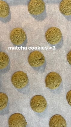 cookies are lined up in rows on a baking sheet with the words matcha cookies - 3