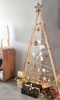 a small christmas tree with ornaments on it