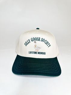 Two-toned green and natural snapback hat CALLING ALL SILLY GEESE! This hat is for the Silliest of Geese ONLY ! This is your official lifetime membership card into the Silly Goose Society! WELCOME - it's the best society to be in! Silly Goose, Hat Patches, Event Gifts, Embroidered Hat, Membership Card, Embroidered Hats, Cool Hats, Snapback Hat, Paper Goods