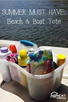 a bucket filled with toys sitting on top of a boat next to the water and text summer must have beach & boat tote