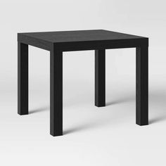 a black square table with two legs on the top and one leg up against it