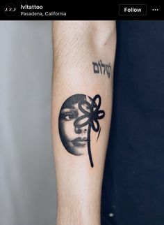 a person with a tattoo on their arm