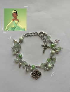 this bracelet was inspired from the movie Princess and the Frog :) it's supposed to look like tianas green dress that she wore, I tried to include all the colors! Here's a few things of how to take care of this bracelet, it's super simple * please don't get this bracelet wet, like putting water on it or any other liquid * also handle it gently when putting it on and off your wrist :) Princess Tiana Gift Basket, Disney Princess Inspired Jewelry, Disney Princess Inspired Bracelets, Princess And The Frog Bracelet, Adjustable Whimsical Green Bracelets, Whimsical Adjustable Green Bracelets, Whimsical Green Beaded Bracelets, Princess And The Frog Jewelry, Tiana Bracelet