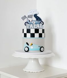 a birthday cake with a racing car on top