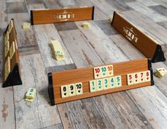 several wooden blocks with numbers on them sitting on the floor