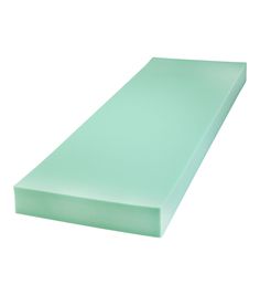 a light green foam mattress on a white background