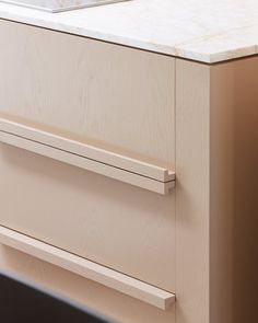 a kitchen counter top with drawers and a sink