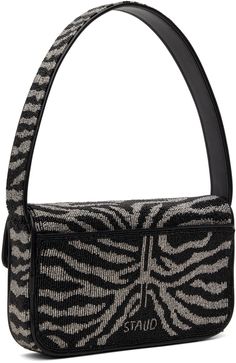 Hand-beaded shoulder bag in black and white. · Croc-embossed faux-leather trim throughout · Graphic pattern throughout · Fixed carry handle · Beaded logo at back face · Patch pocket · Magnetic press-stud flap · Zip pocket at interior · Satin lining · H6 x W10 x D2 Supplier color: Black/White Staud Black Top Handle Bag, Staud Luxury Black Bag, Staud Black Shoulder Bag, Staud Tommy Beaded Bag, Black Beaded Shoulder Bag, Face Patches, Press Studs, Beaded Bags, Graphic Patterns