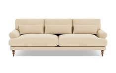 a beige couch sitting on top of a white floor