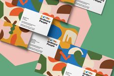 three business cards with different shapes and colors on the front, back and side of each card