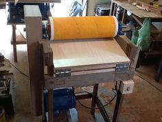 a workbench with a roll of yellow paper on it