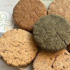 several cookies are arranged on a white plate