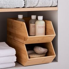 a bamboo shelf with soaps, towels and other items