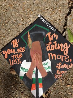 a decorated graduation cap with writing on it