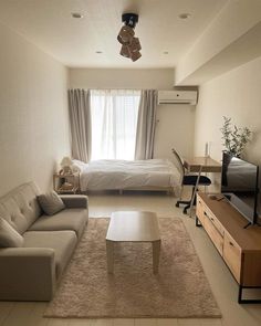 a living room filled with furniture and a flat screen tv