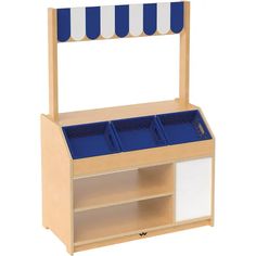 a wooden shelf with two blue bins on top and one white bin below it