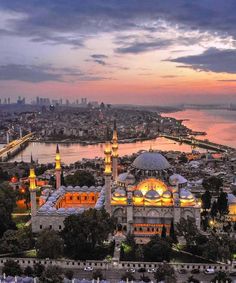 an aerial view of the blue mosque at sunset