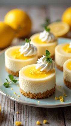 Mini Lemon Cheesecakes Mini Lemon Cheesecake Bites, Individual Lemon Cheesecakes, Lemon Blueberry Tartlets, Lemon Cheesecake Thumbprint Cookies, Lemon Cheesecake Muffins, Mini Lemon Tart Recipe, Lemon Cheesecake Dessert, Christmas Lemon Dessert, Individual Lemon Desserts