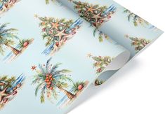 a blue wrapping paper with palm trees and starfishs on the top, in front of a white background