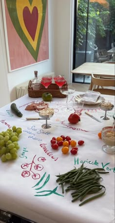 the table is covered with various fruits and vegetables