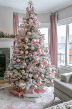 a pink and silver christmas tree in a living room