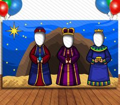 three wise men standing in front of a backdrop with balloons