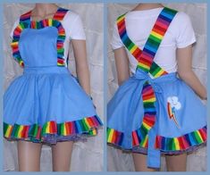 a woman wearing a rainbow colored dress and suspenders