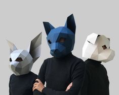 three people in animal masks standing next to each other