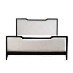 the bed frame is black and white with an upholstered headboard on it