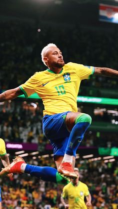 a man is jumping in the air while playing soccer