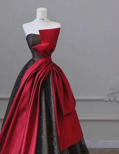 a red and black dress on a mannequin