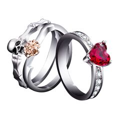 three rings with two heart shaped stones and one diamond on each side, set in white gold