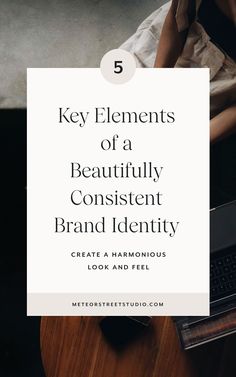 a person sitting at a desk with a laptop on it and the text 5 key elements of a beautifully content brand identity