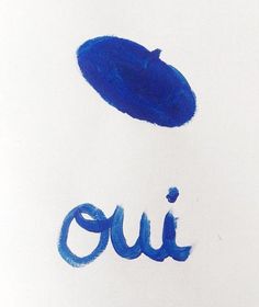 the word ouu written in blue ink on white paper with an oval shaped object above it