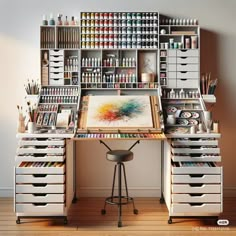 an artist's desk with lots of paint and art supplies on the shelves next to it