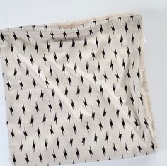 a piece of cloth with black and white designs on it