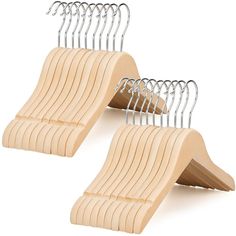 two wooden hangers with clips attached to them