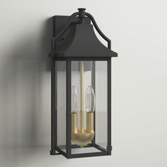 an outdoor wall light with two lights on the side and one light on the inside