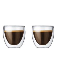 two glasses with coffee in them on a white background