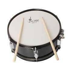 a black and white drum set with two sticks