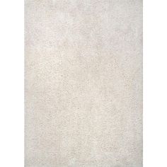 a white rug with small dots on it