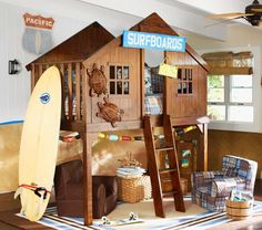 a child's bedroom with a wooden bunk bed and ladders to the roof