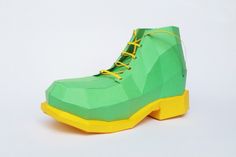 a pair of green and yellow paper shoes