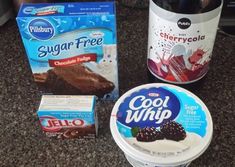 some ice cream, chocolate cake and yogurt are sitting on the counter top