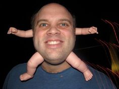 a man holding a baby up to his face with the caption's name underneath it