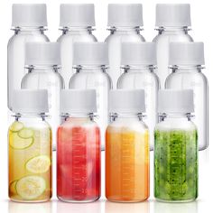 six bottles filled with different colored liquids and slices of cucumber in them