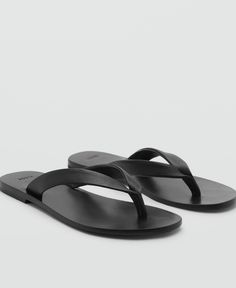 in stock Sleek Single Toe Strap Sandals For Beach, Sleek Open Toe Flip Flops For Beach, Classic T-strap Sandals For Summer Beach, Sleek Leather Flip Flops For Summer, Classic T-strap Sandals For Beach Summer, Sleek Open Toe Sandals For The Beach, Black Toe Post Sleek Sandals, Sleek Sandals For Summer Beach, Classic Black Sandals For Vacation